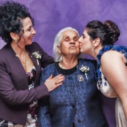 woman-kissing-woman-s-cheek