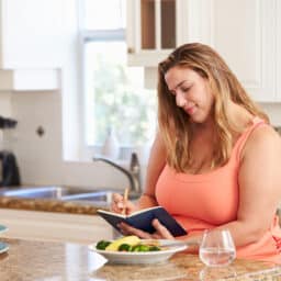 Woman tracking her tinnitus in a diary