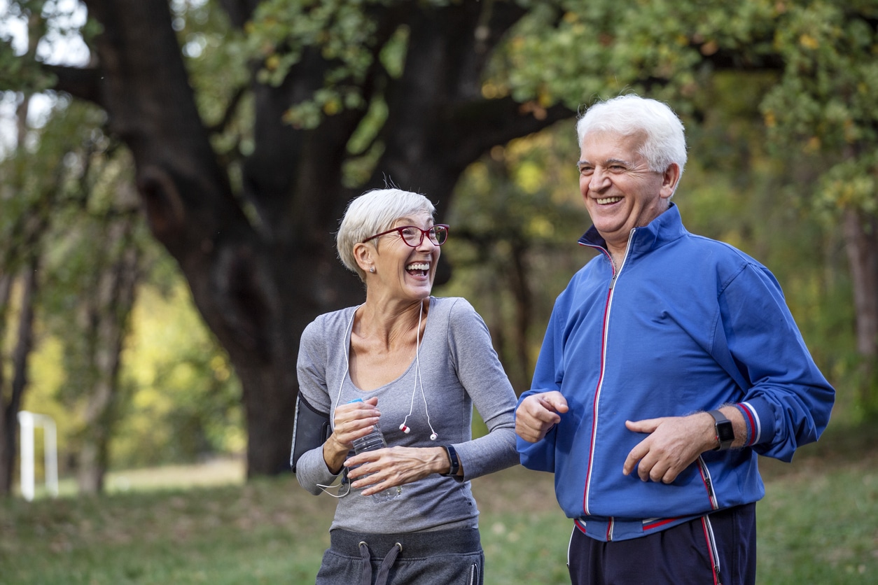 Two friends going for a run in the park.