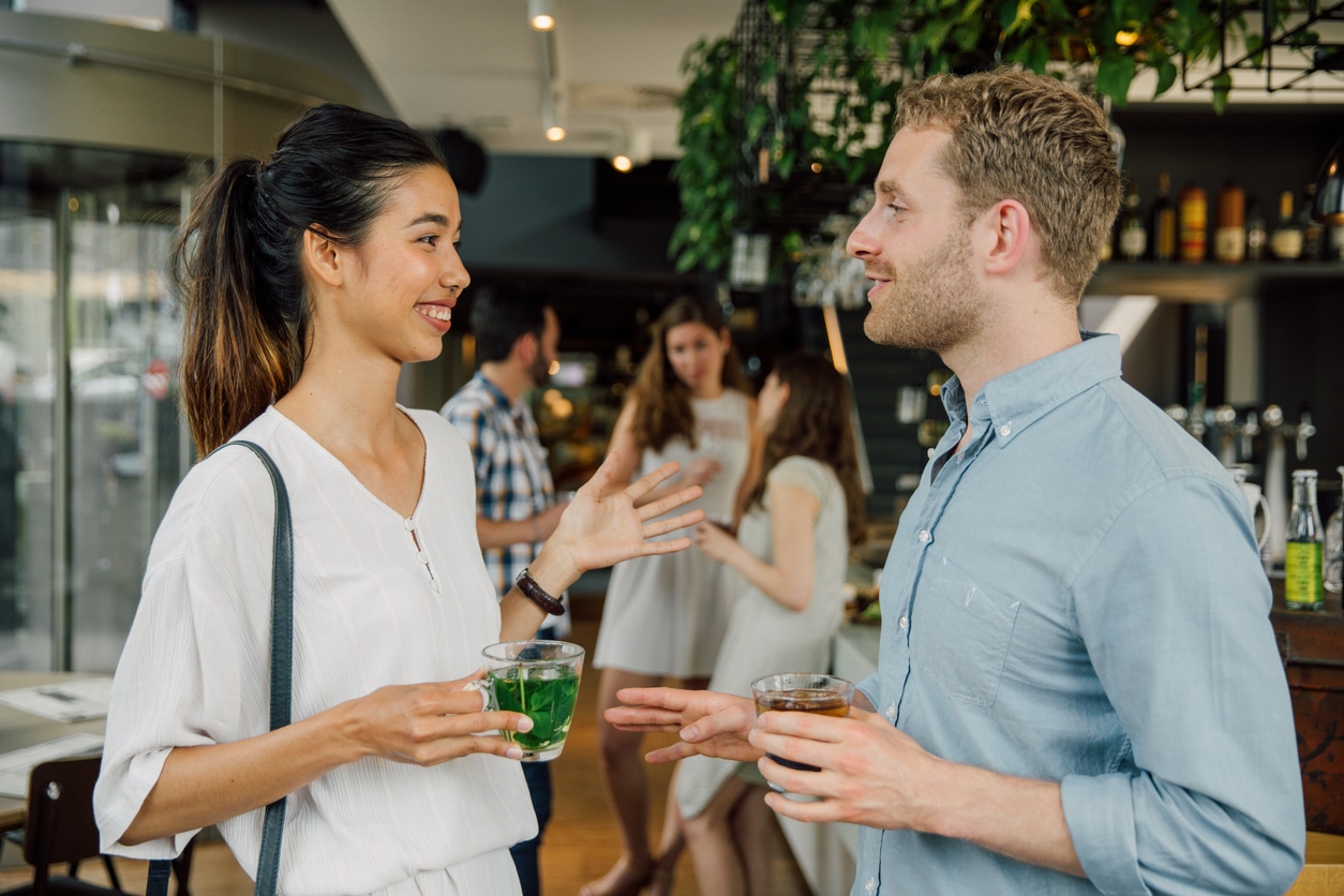 Two friends talking at a cafe