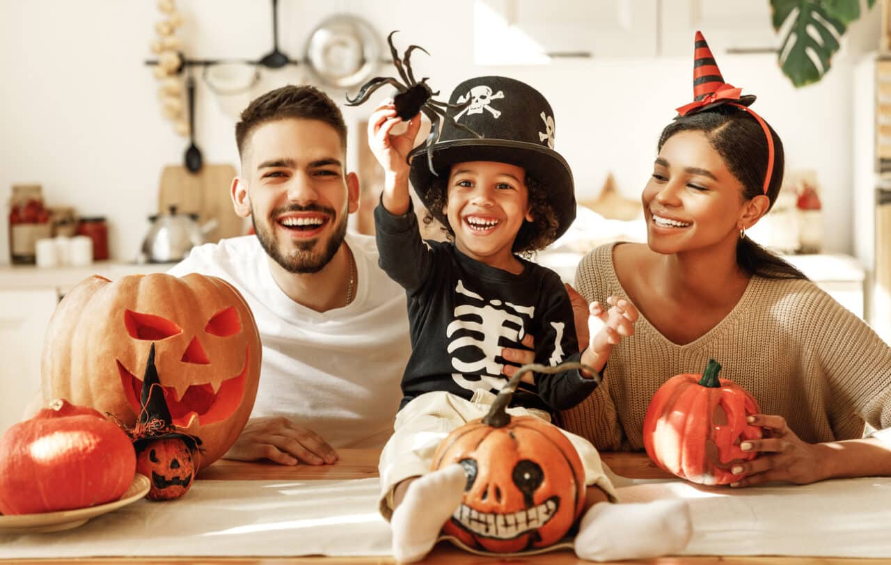 Happy family with halloween decorations.