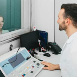 Audiologist conducting a hearing test.