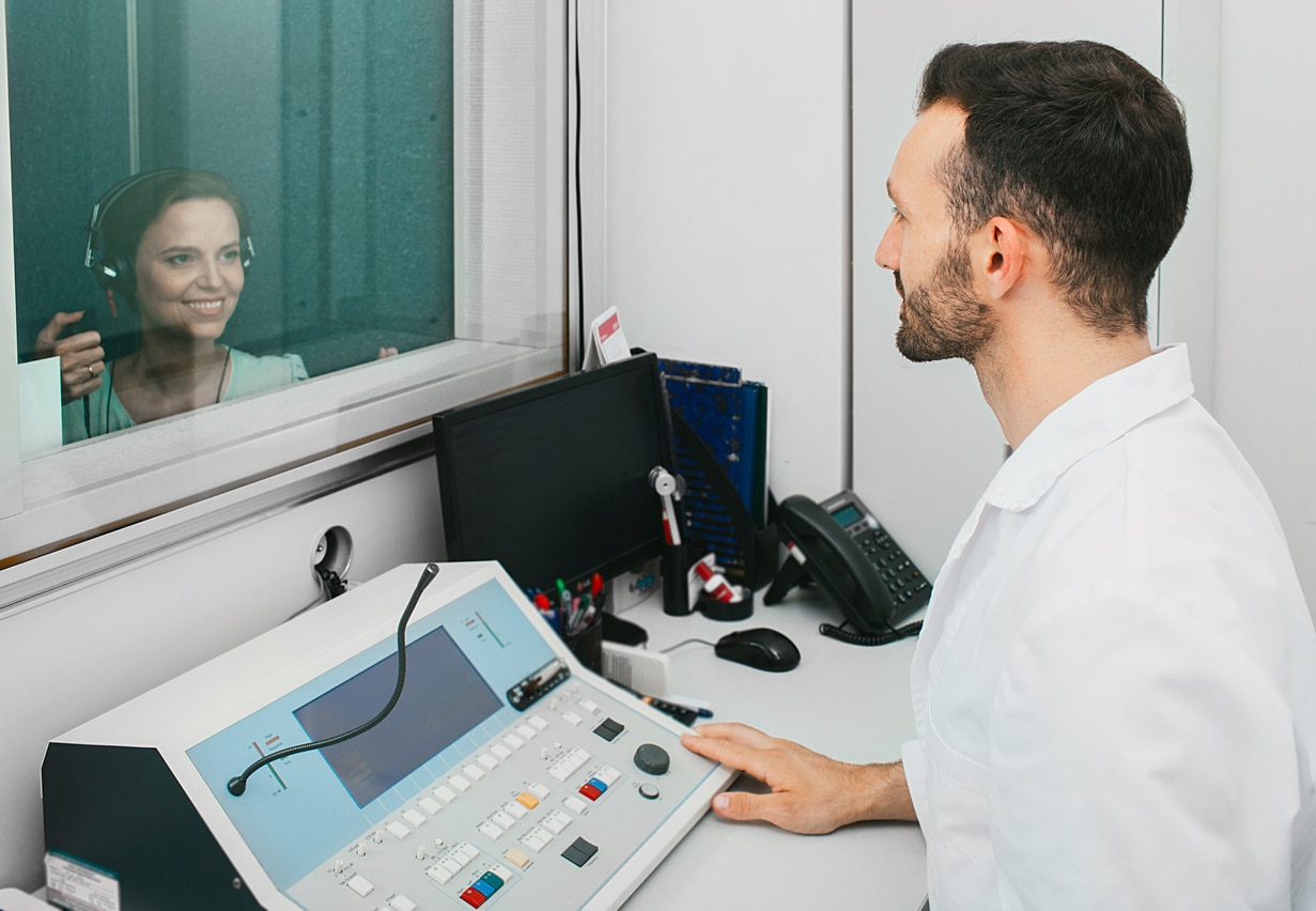 Audiologist conducting a hearing test.