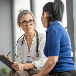 Doctor talking to her patient.