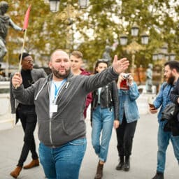 Tour guide leading a walking tour of the city.