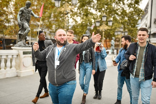 Tour guide leading a walking tour of the city.
