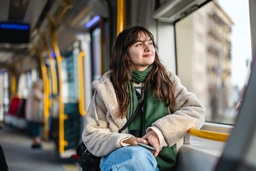 Smile Gen Z girl on the subway.