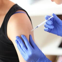 Woman receiving an immunotherapy shot.