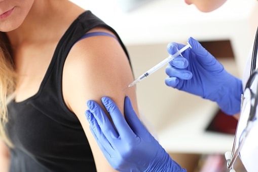 Woman receiving an immunotherapy shot.